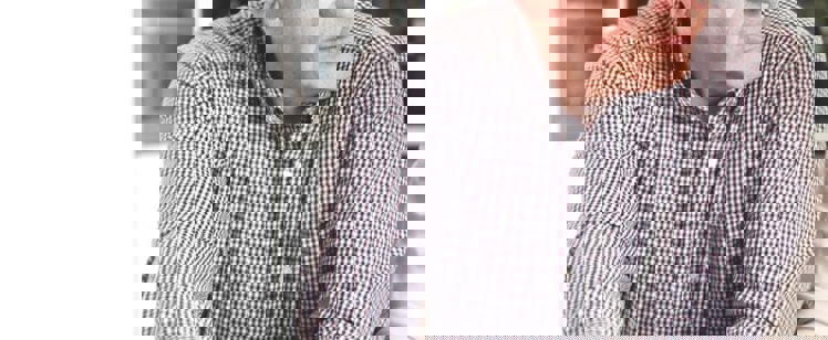 A picture of a couple discussing some paperwork